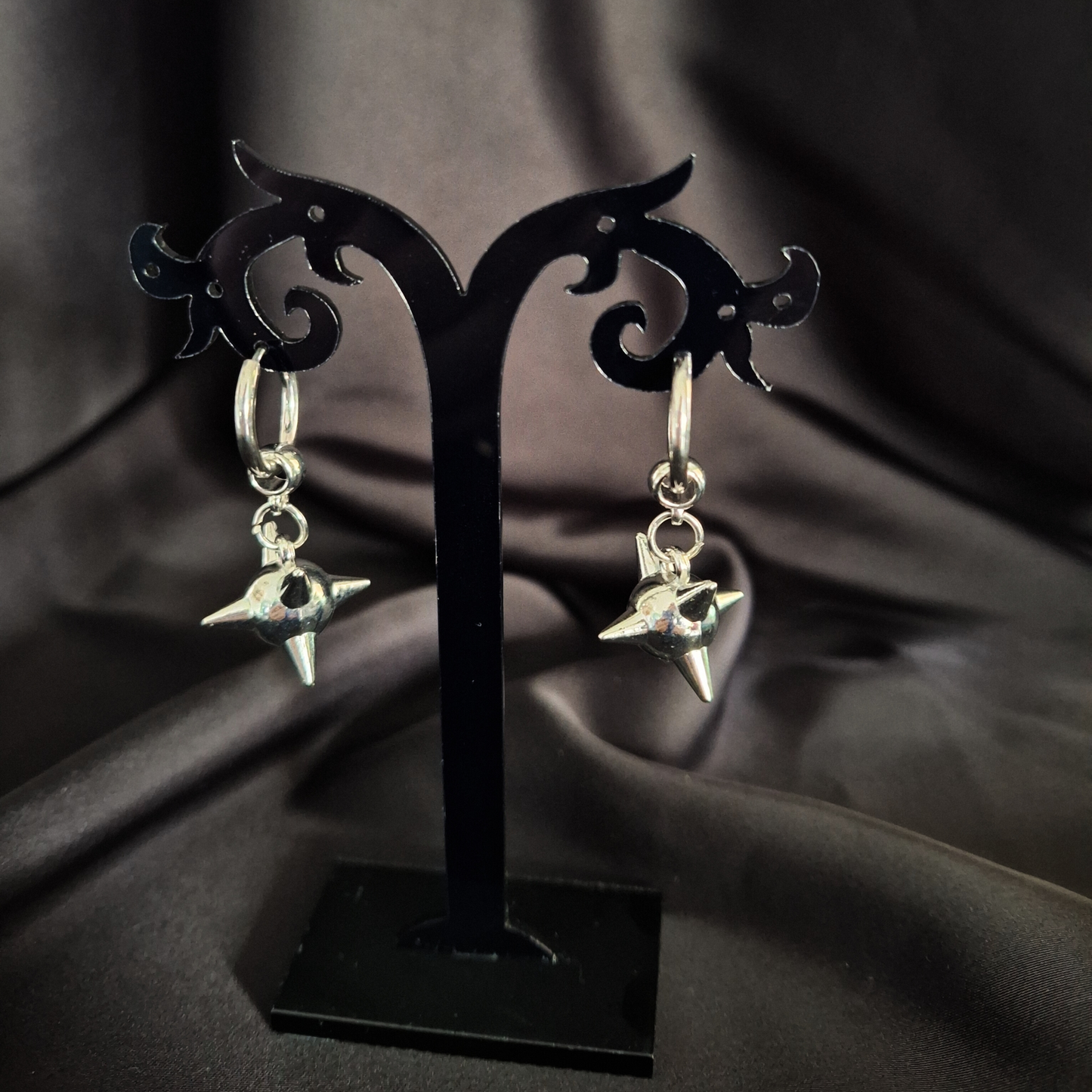 Love Never Flails Clicker Earrings